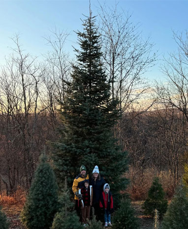 Family at Christmas tree